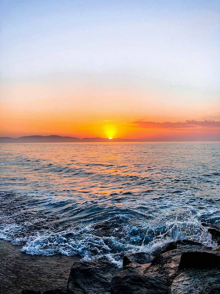 ocean seashore during sunset water